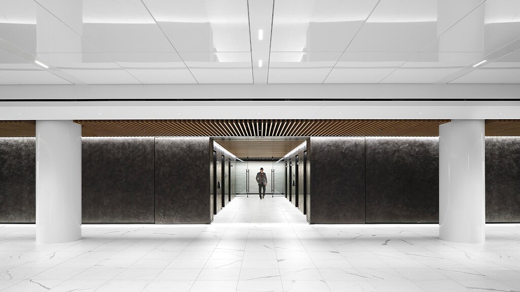 A person standing in a large room.