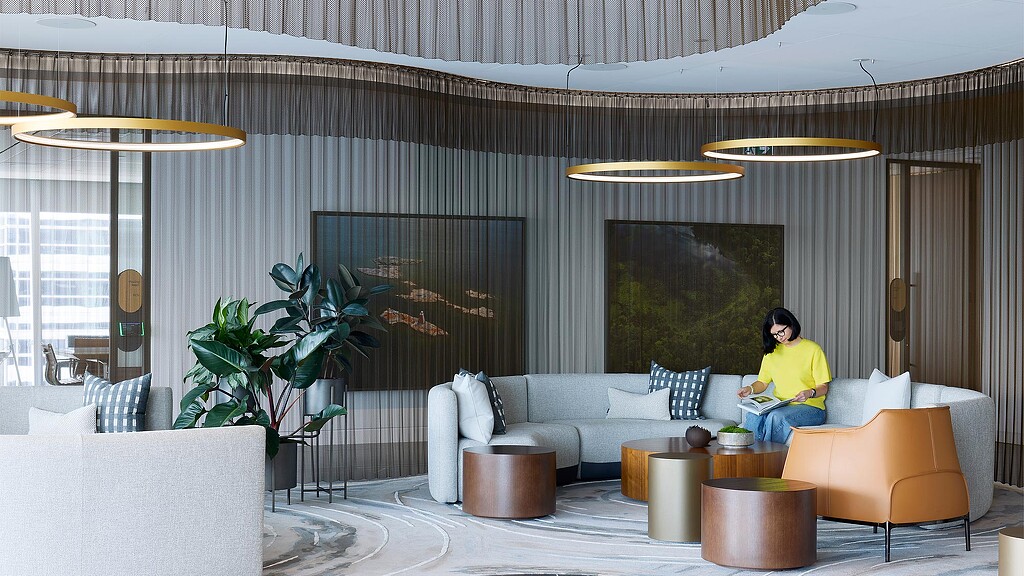 A person sitting in the lounge area of Ontario's Teachers' Pension Plan.