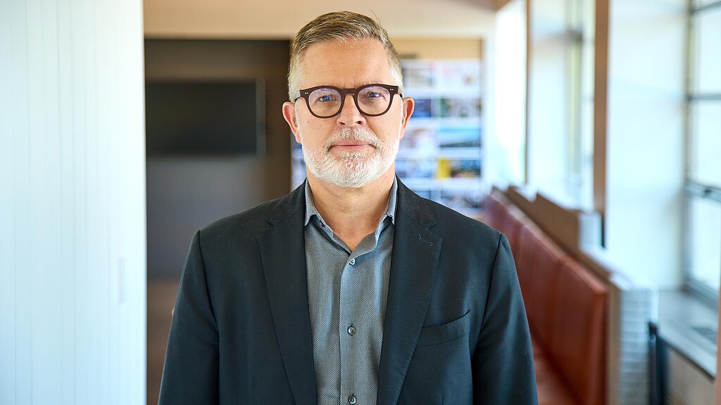 A man wearing glasses.