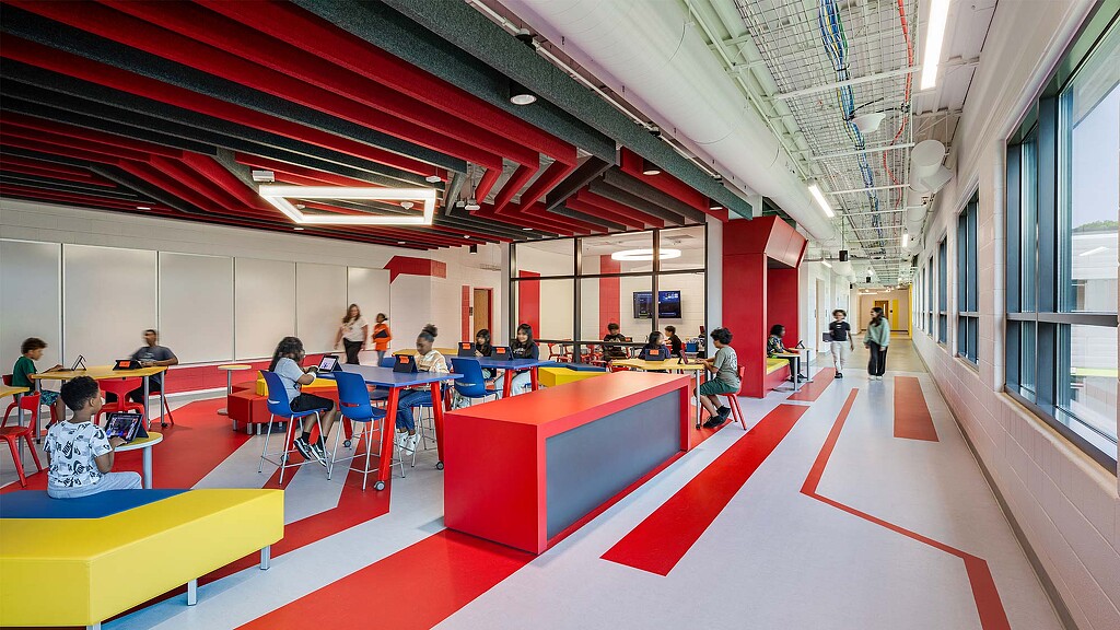 A group of people sitting at tables.