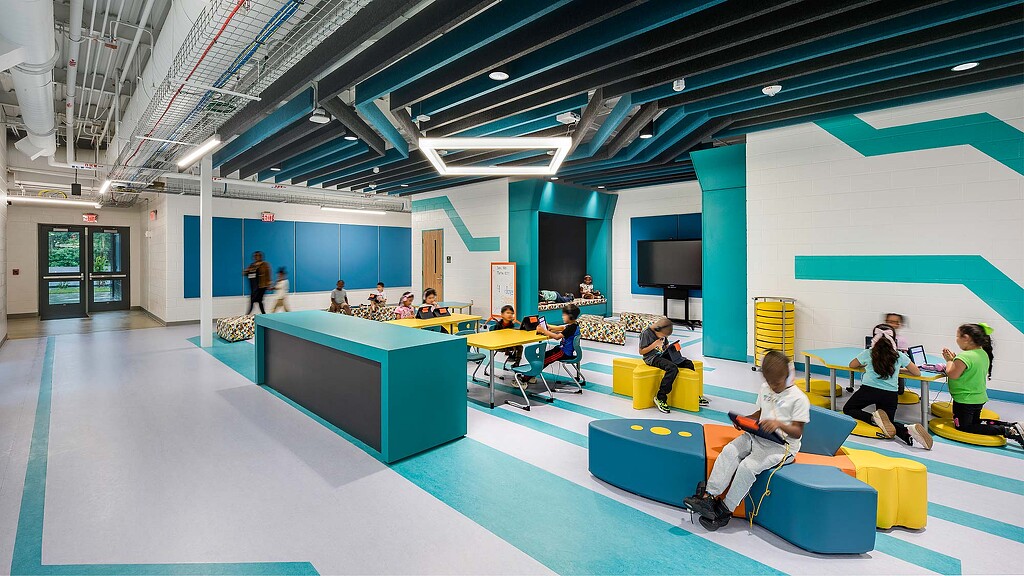 A group of people sitting at tables.