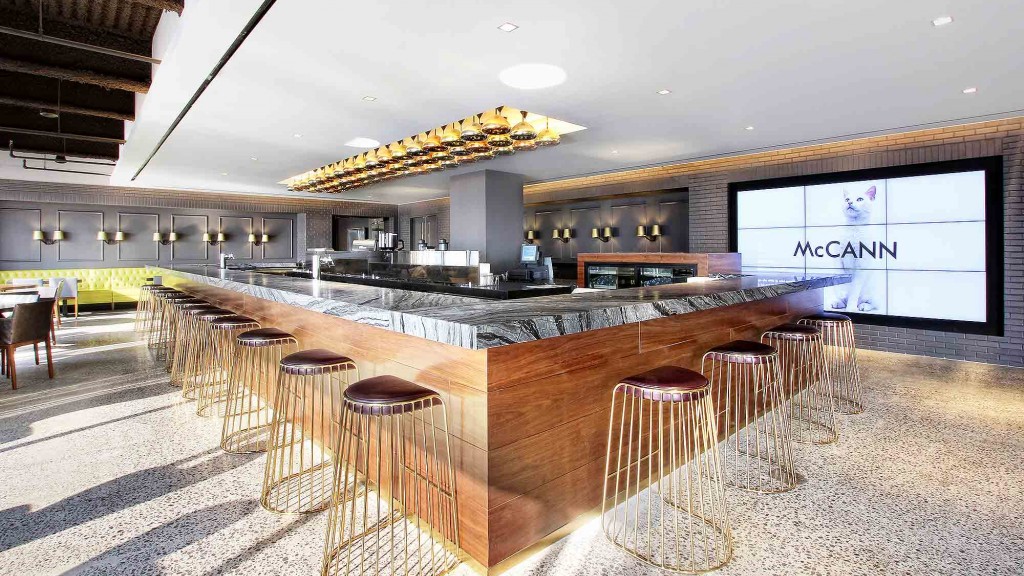 A large room with tables and chairs.