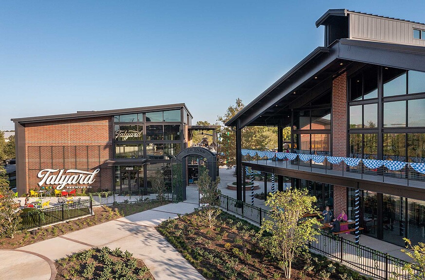 A building with a walkway and a fence.