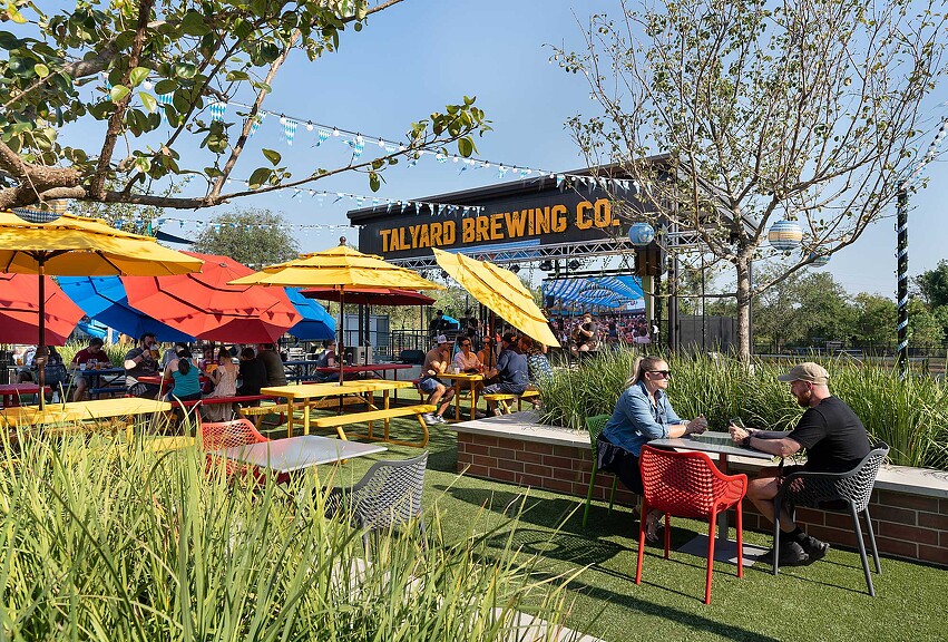 People sitting at tables outside.