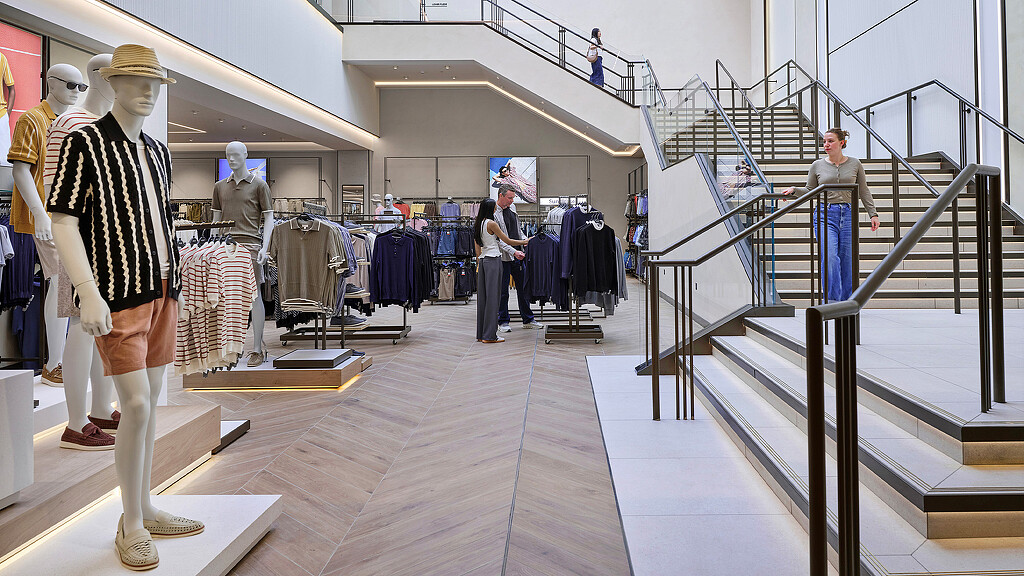 A group of people walking down a flight of stairs.