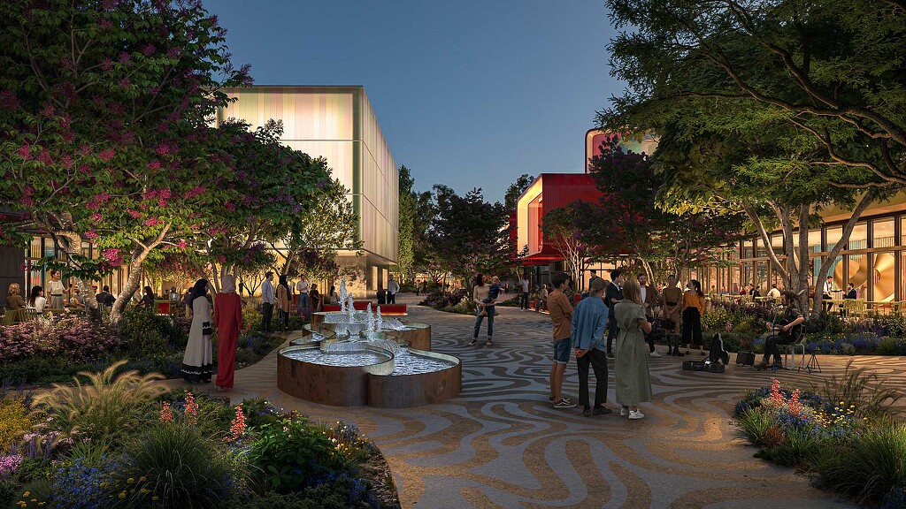 A courtyard with people and flowers.