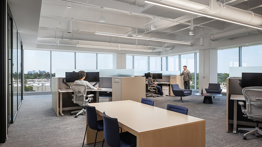 A person standing in an office.