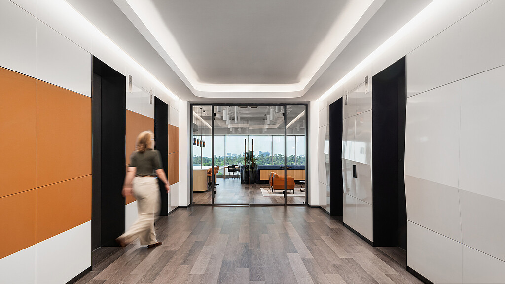 A person walking in a hallway.