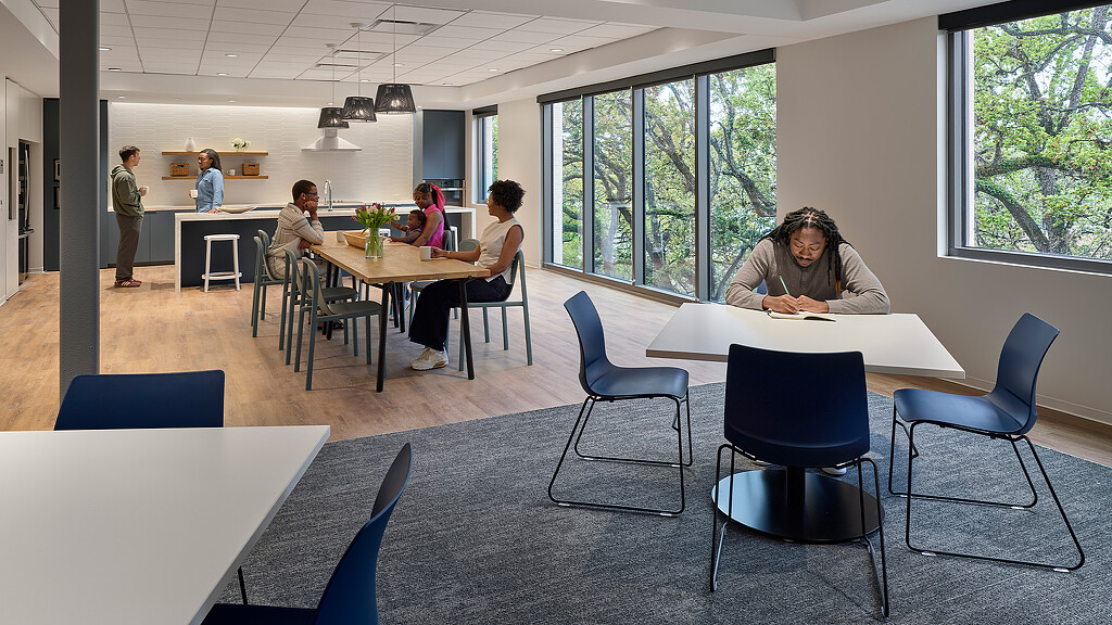 A group of people sitting around a table.