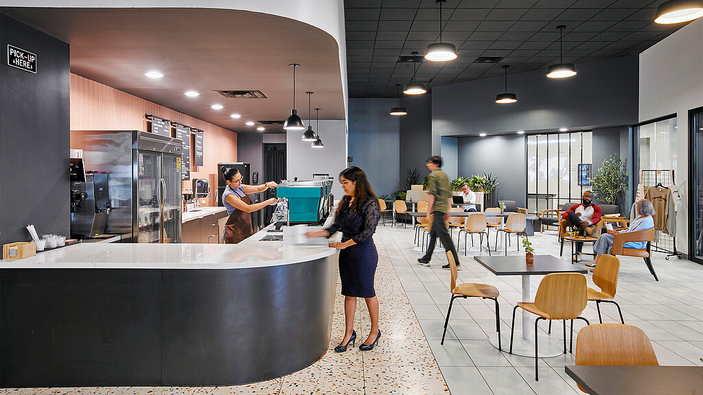 A person standing in a kitchen.