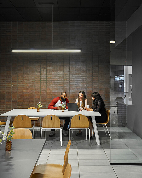 A group of people sitting at a table.