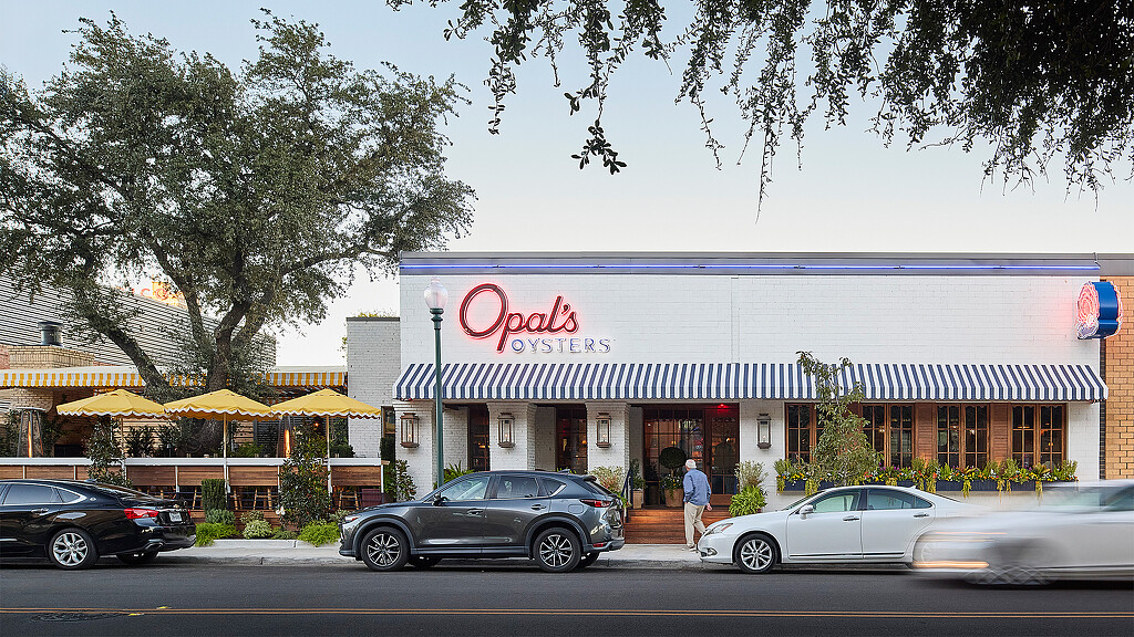 A building with cars parked in front.