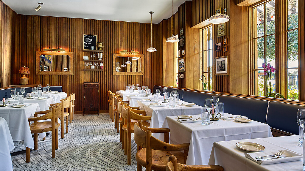 A room with tables and chairs.