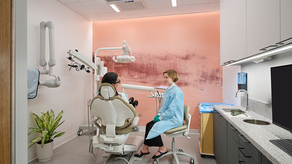 A woman and a man in a dental office.