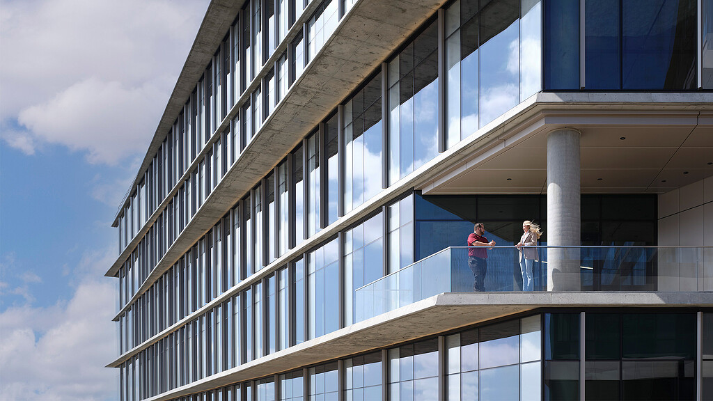 A few women standing outside a building.