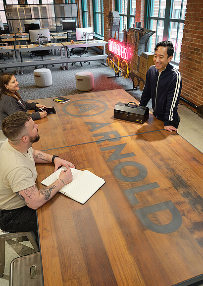 A group of people sitting around a table.