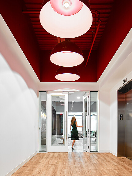 A person walking through a hallway.