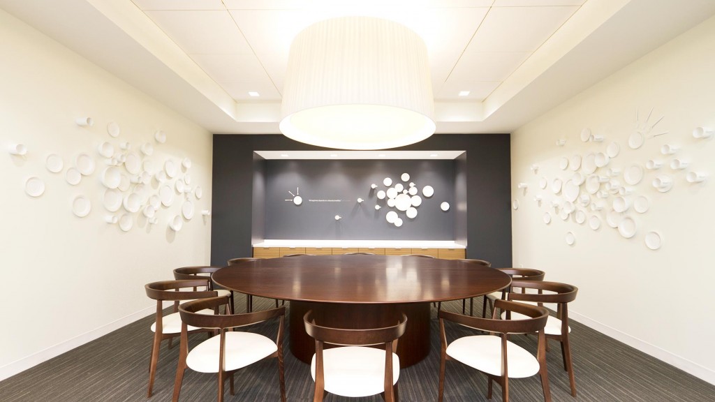 A room with a table and chairs.