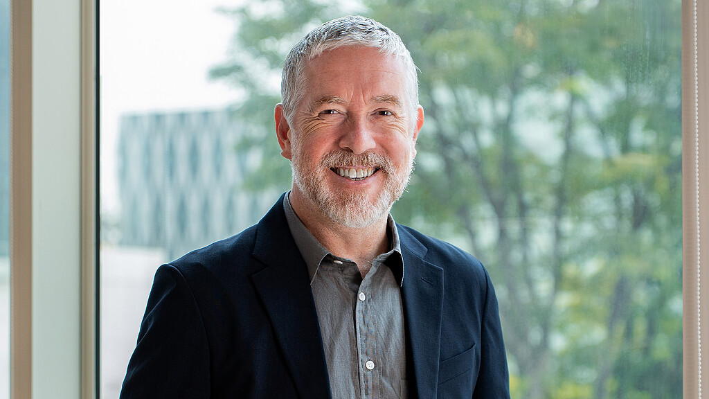 A man smiling for the camera.