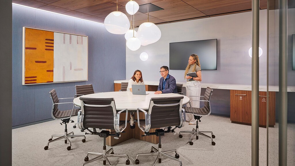 A man and a woman in an office.