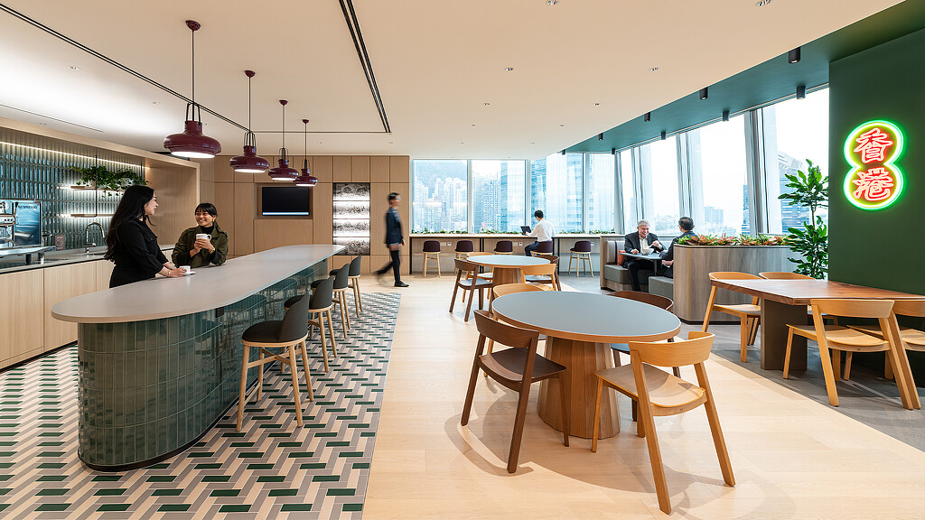 A group of people sitting at tables.