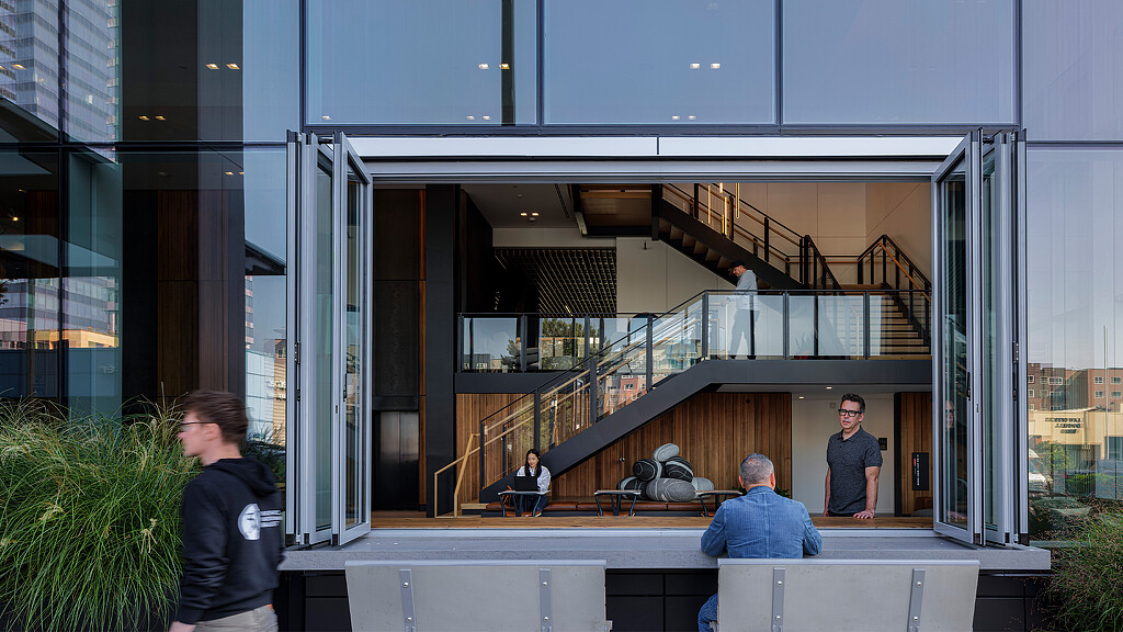 A group of people sitting on a balcony.