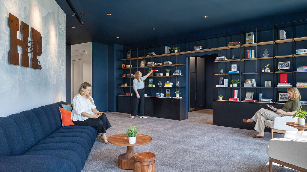 A group of people in a library.