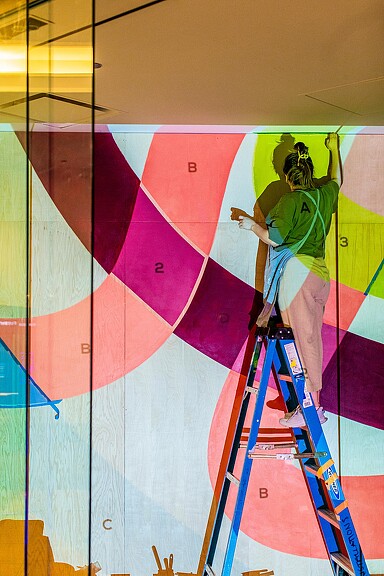 A person painting a wall.