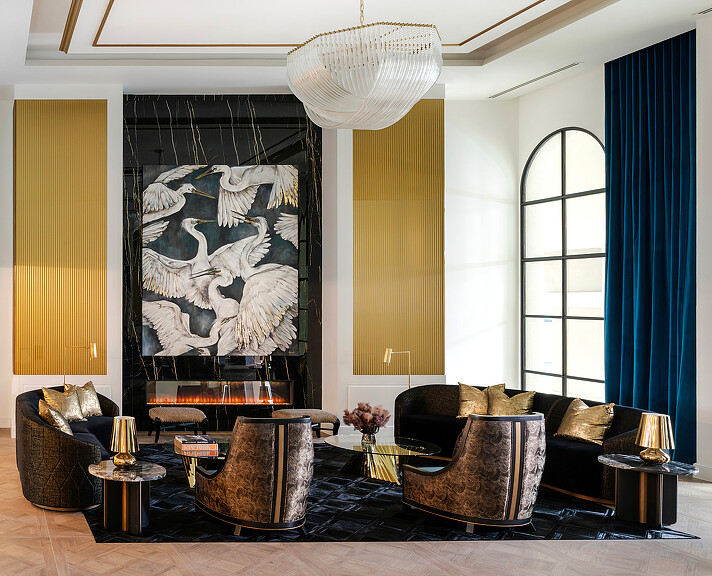 A living room with a large painting.