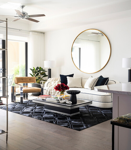 A living room with a large mirror.