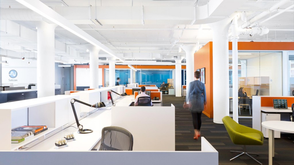 A person walking in an office.