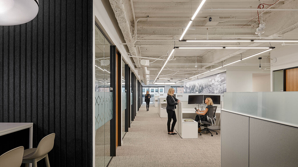 A few people in an office.