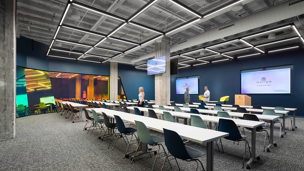 A room with tables and chairs.