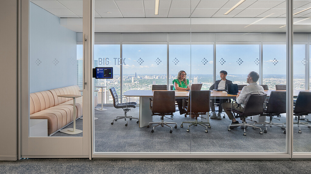 A few people sitting at a table.