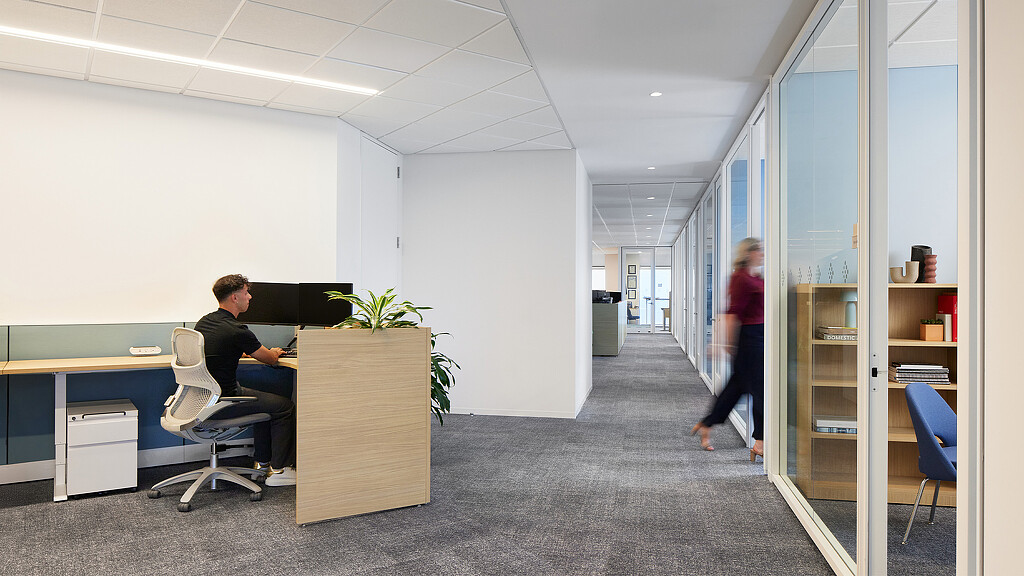 A man and a woman in an office.