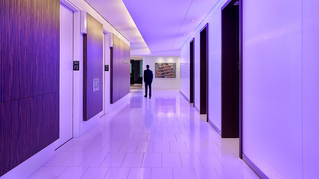 A person walking in a hallway.