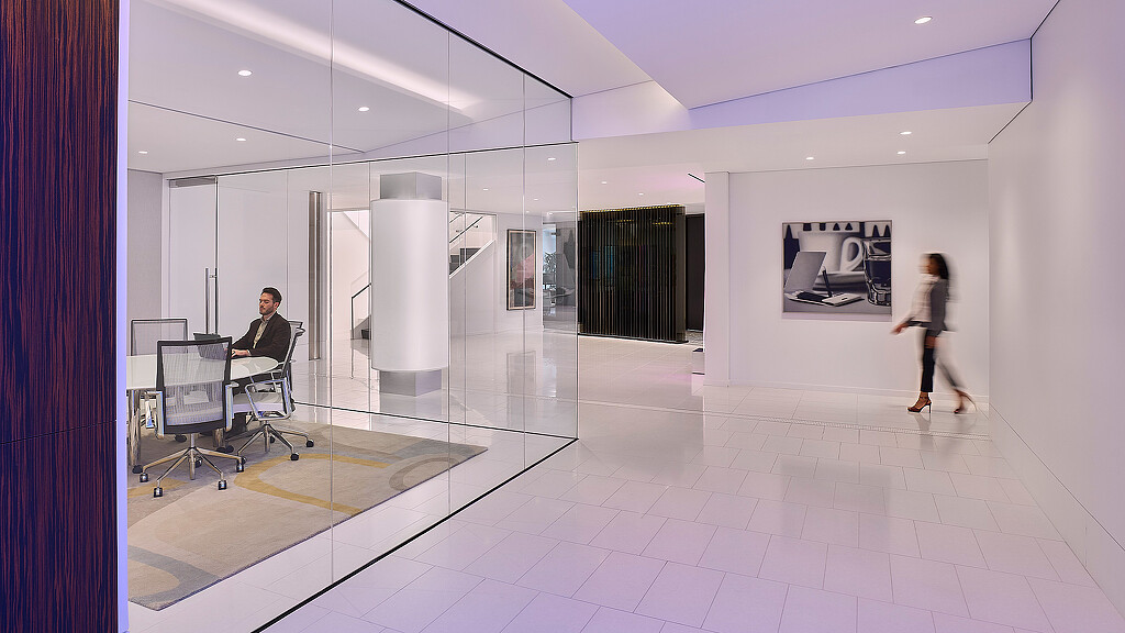 A person walking in a room.