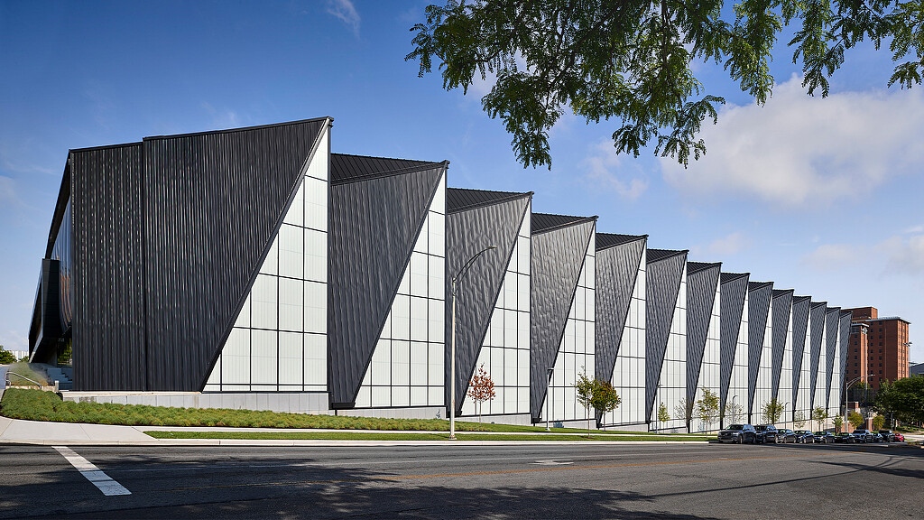 A large building with a fire in the front.
