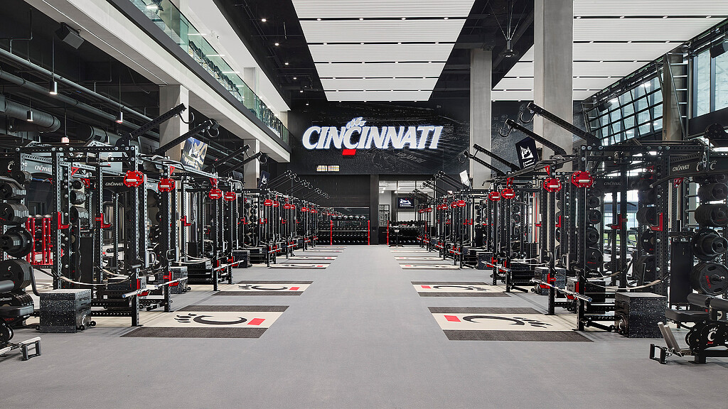 A large room with a large group of people in it.