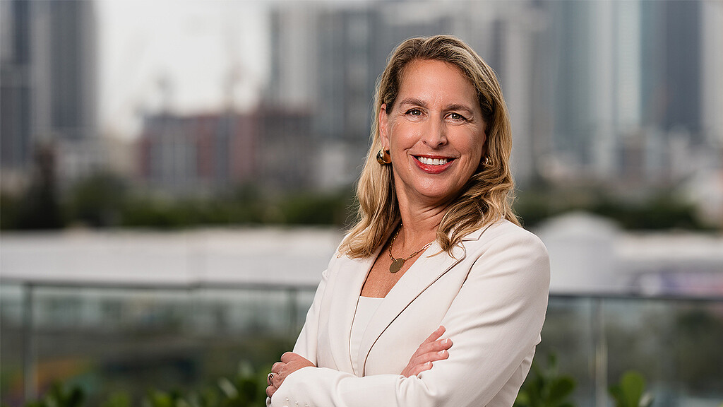 A woman with her arms crossed.