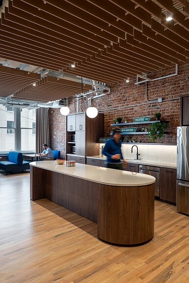 A person standing in a kitchen.