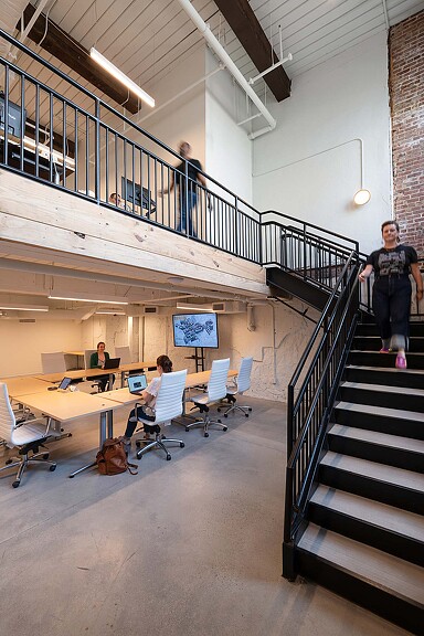 People sitting at tables in a building.