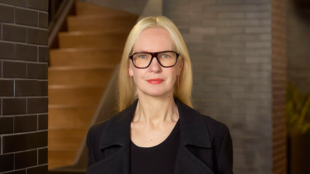 A woman wearing glasses.