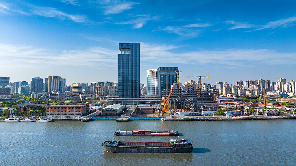 A city skyline with boats.