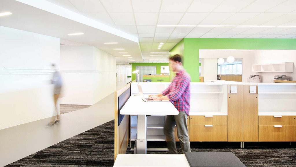 A person standing at a desk.