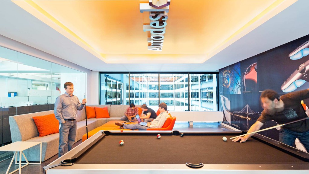 A group of people playing pool.