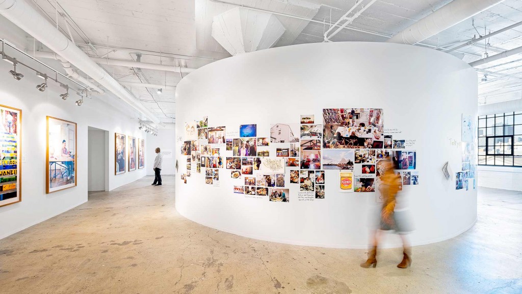A large white wall with pictures on it.