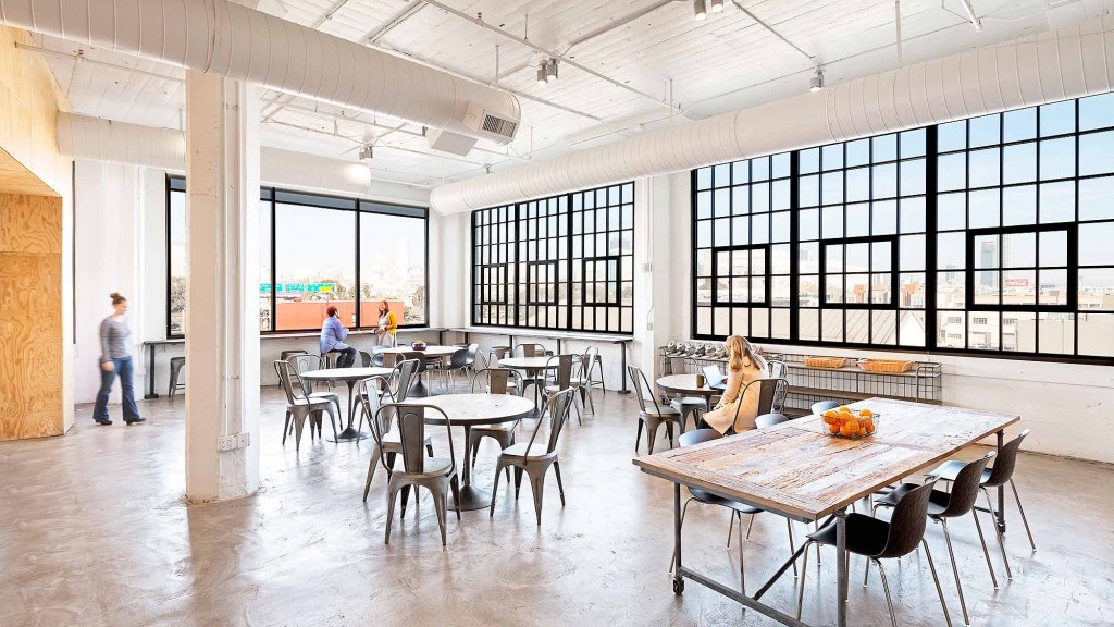 A large room with tables and chairs.