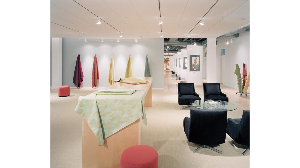 A room with a table chairs and a couch.