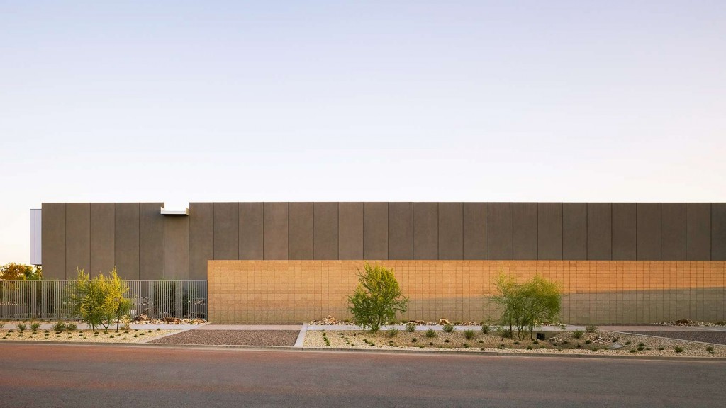 A large building with a fence around it.